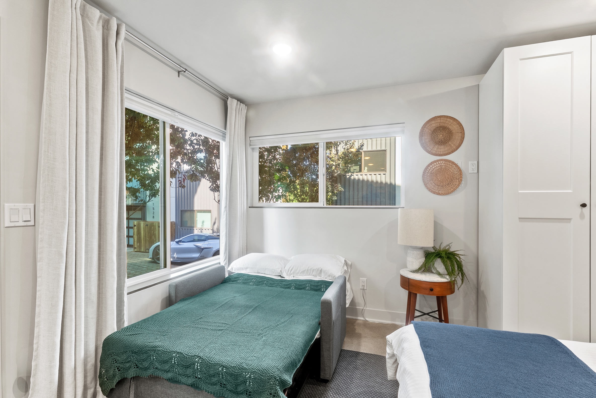 The sofa converts to a second bed by the windows